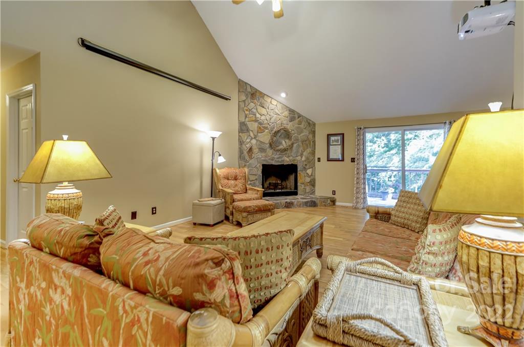 6023 Lanai Lane Tega Cay, SC 29708 - Photo 5 of 43 a living room with furniture fireplace and a flat screen tv