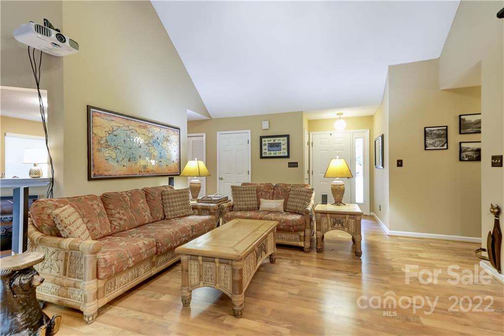 6023 Lanai Lane Tega Cay, SC 29708 - Photo 6 of 43 a living room with furniture and wooden floor