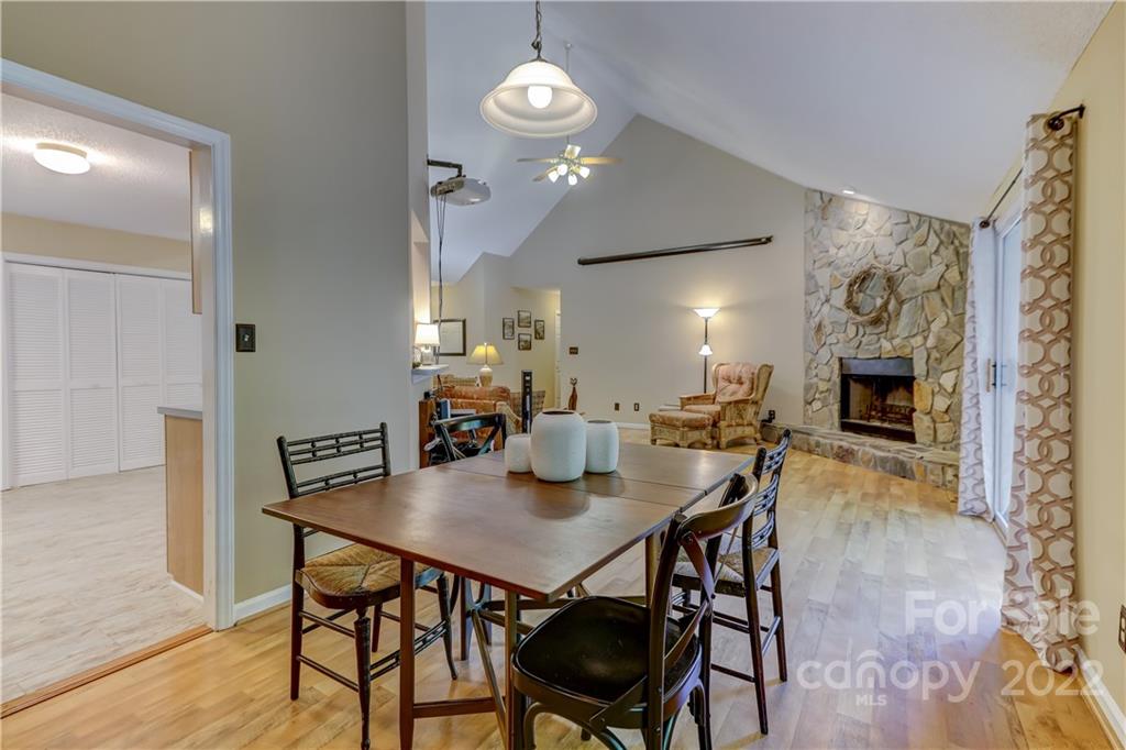6023 Lanai Lane Tega Cay, SC 29708 - Photo 10 of 43 a view of a dining room with furniture and wooden floor