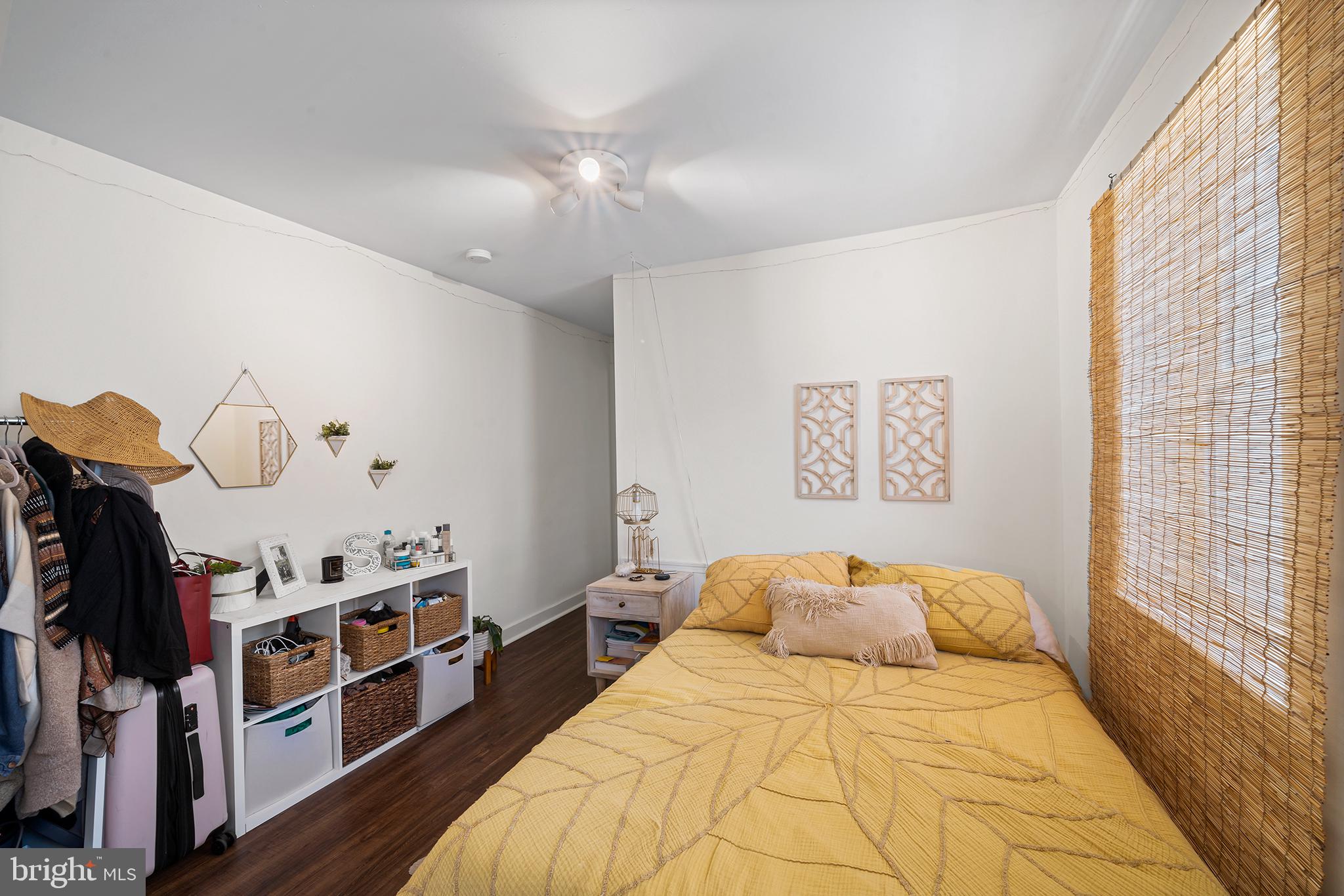 107 Master Street Philadelphia, PA 19122 - Photo 22 of 24 a bedroom with bed and a large window