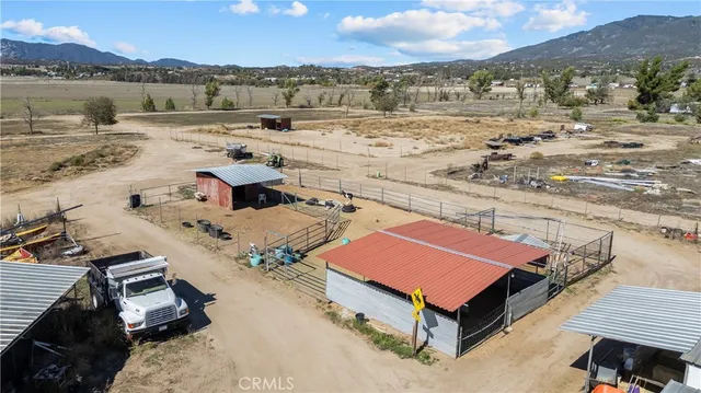a view of a terrace with wooden floor and a mountain