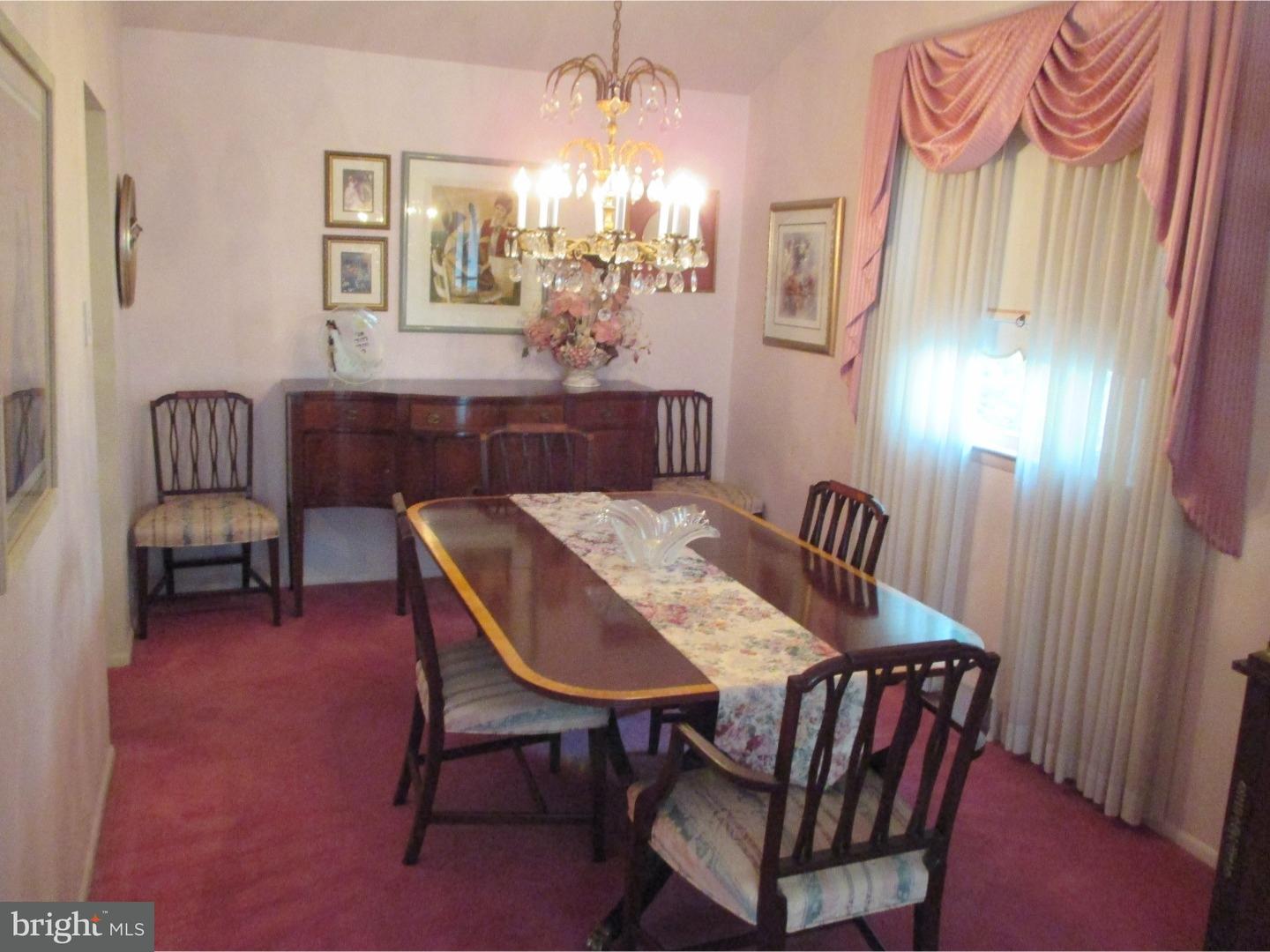 641 Kismet Road Philadelphia, PA 19115 - Photo 11 of 25 a view of a dining room with furniture and a chandelier