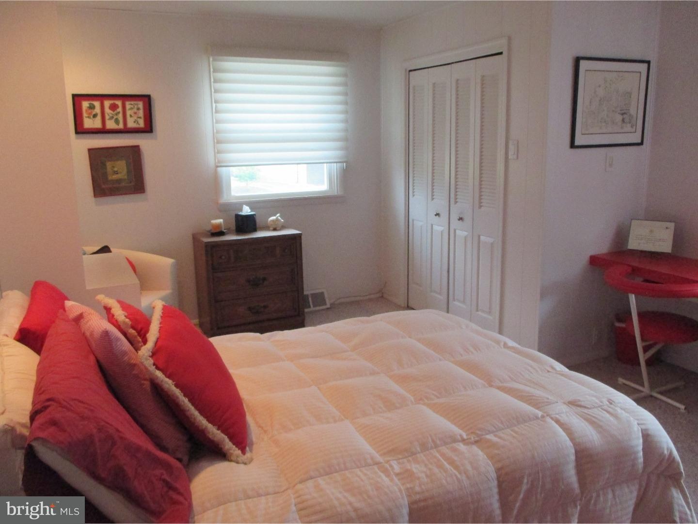 641 Kismet Road Philadelphia, PA 19115 - Photo 19 of 25 a bedroom with a bed and a window