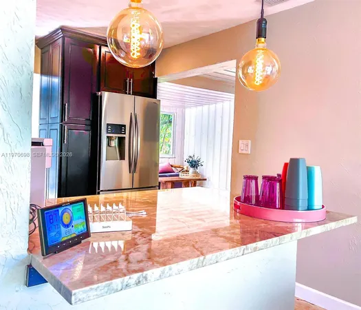 a lobby with furniture and chandelier