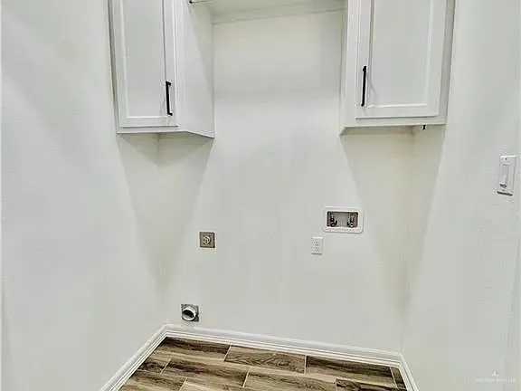 a view of small space with white cabinets