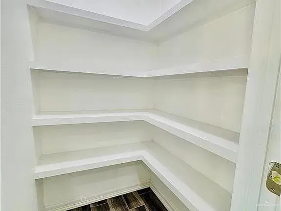 a view of an empty walk in closet