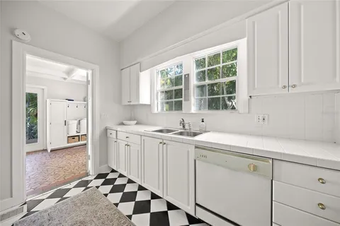 a kitchen with a sink and cabinets