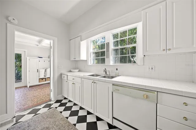 a kitchen with a sink and cabinets