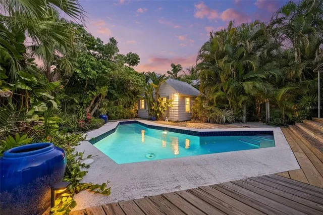 a view of swimming pool with lounge chair