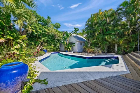 a view of a backyard with sitting area