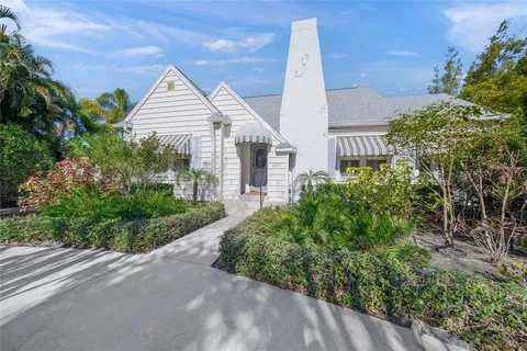 a view of a house with garden and plants