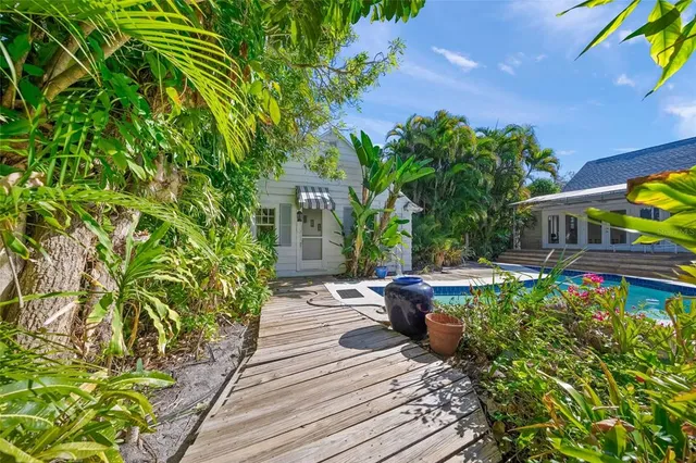 a view of a backyard with sitting area
