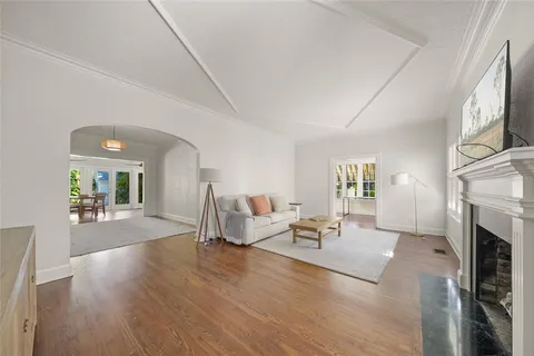 a living room with furniture or fireplace and a wooden floor