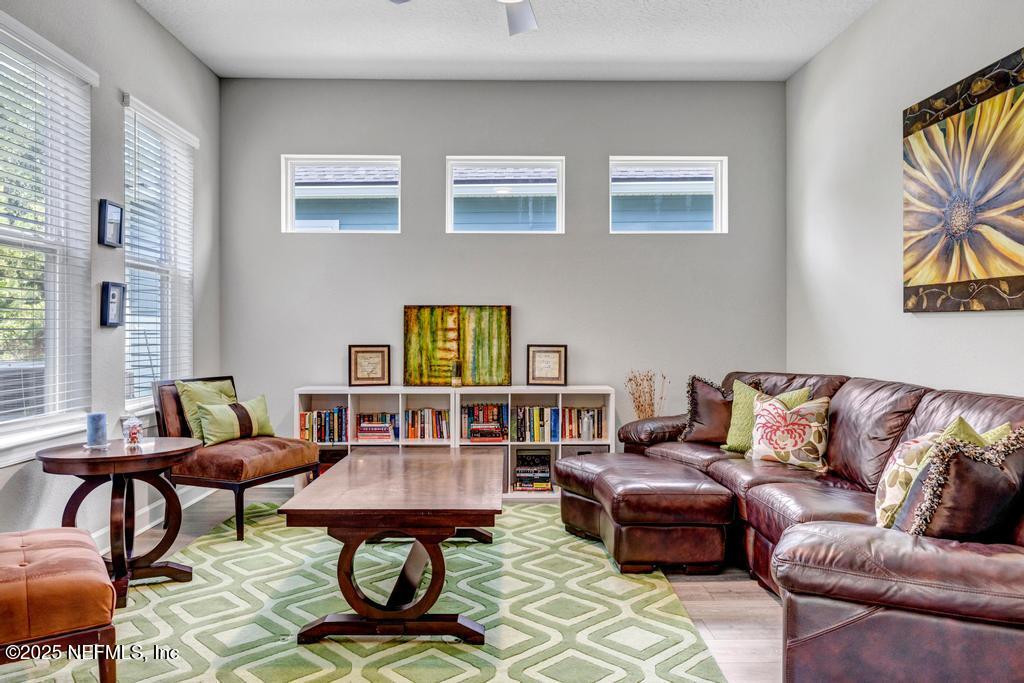 323 Glenneyre Circle St. Augustine, FL 32092 - Photo 18 of 53 a living room with furniture a rug and a window