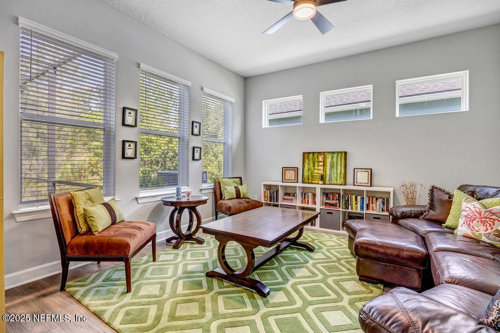 323 Glenneyre Circle St. Augustine, FL 32092 - Photo 19 of 53 a living room with furniture and a window
