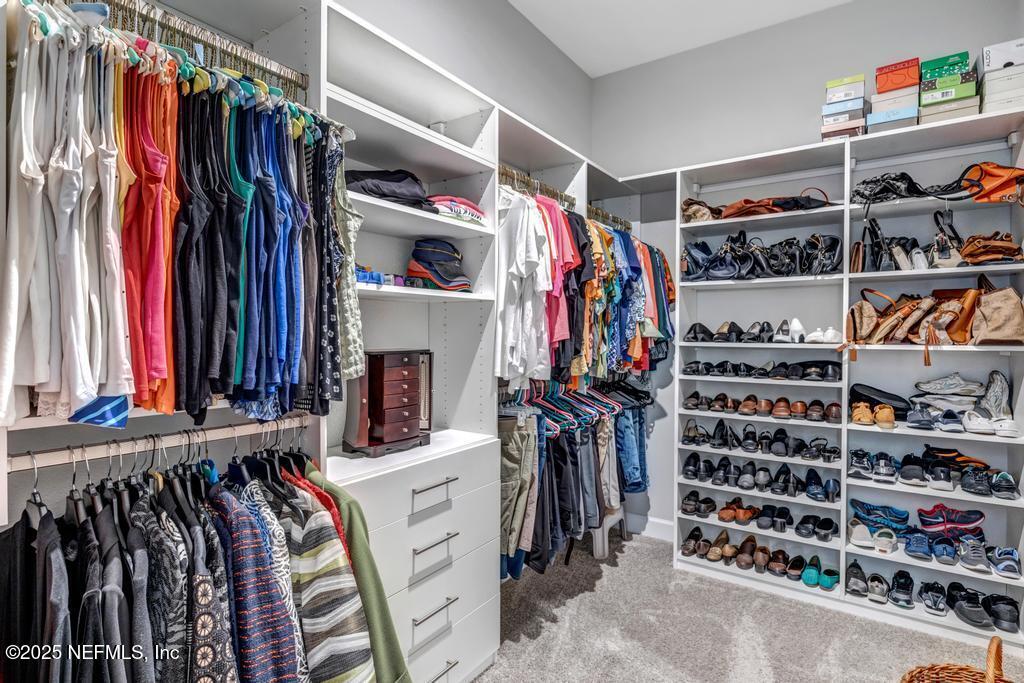 323 Glenneyre Circle St. Augustine, FL 32092 - Photo 29 of 53 a view of walk in closet with clothes and shoes
