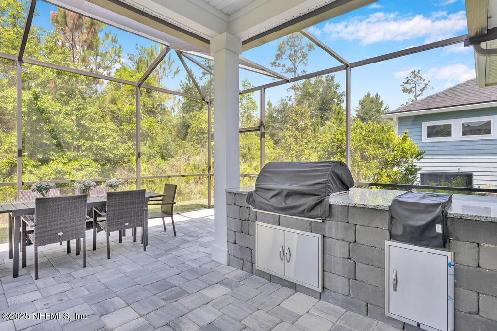 323 Glenneyre Circle St. Augustine, FL 32092 - Photo 45 of 53 a view of a dining room with furniture window and outside view