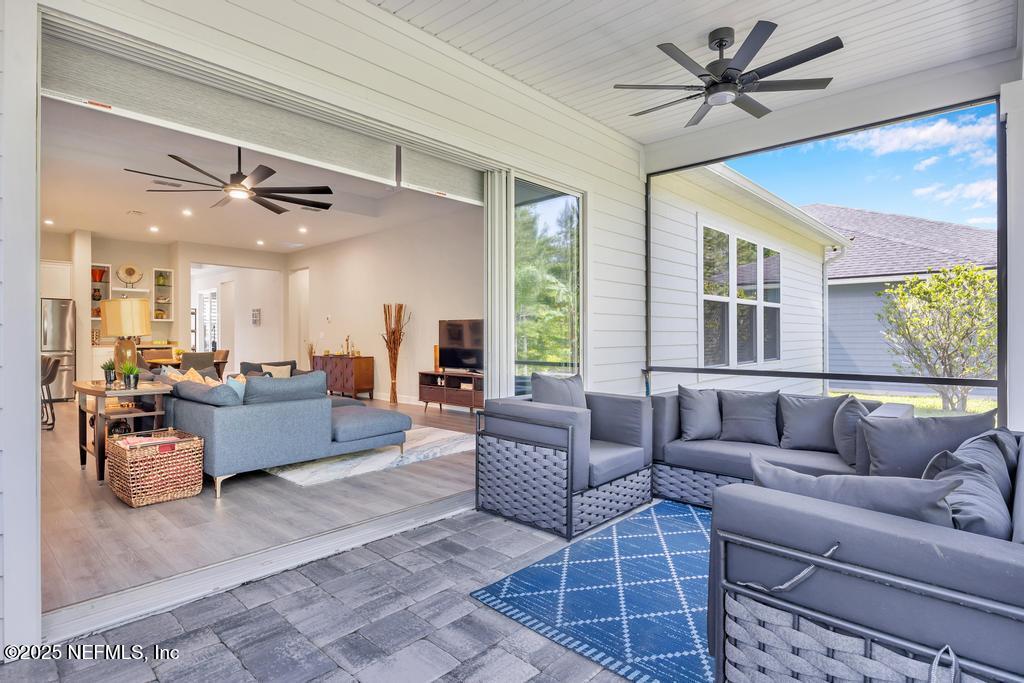 323 Glenneyre Circle St. Augustine, FL 32092 - Photo 46 of 53 a living room with furniture ceiling fan and a rug