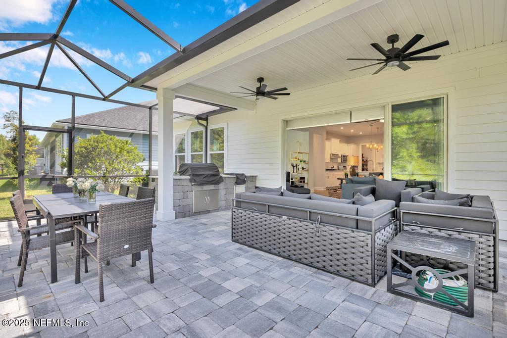 323 Glenneyre Circle St. Augustine, FL 32092 - Photo 47 of 53 a living room with fireplace furniture and a large window