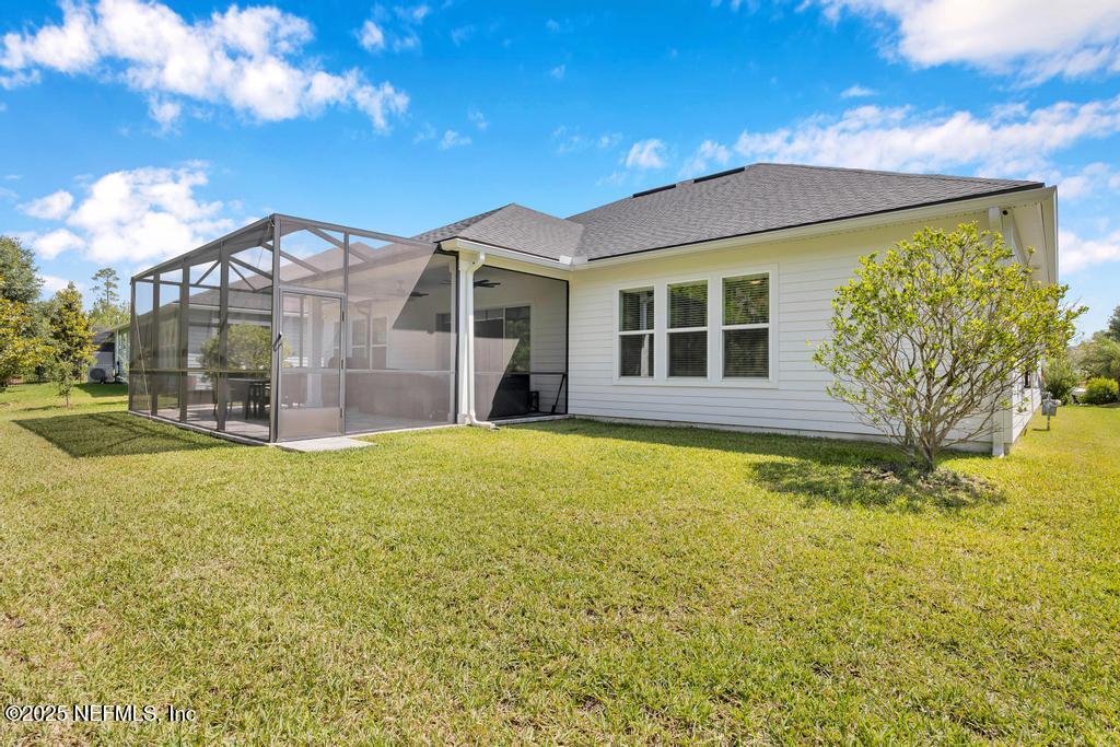 323 Glenneyre Circle St. Augustine, FL 32092 - Photo 48 of 53 a view of a house with a garden and yard