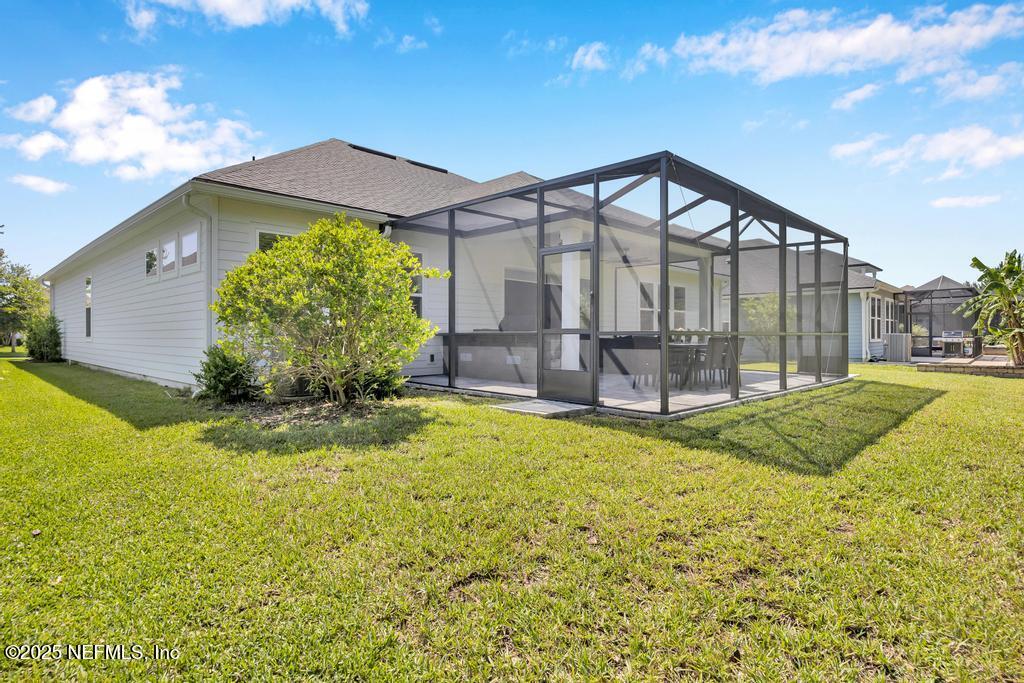 323 Glenneyre Circle St. Augustine, FL 32092 - Photo 50 of 53 a view of a house with backyard and garden