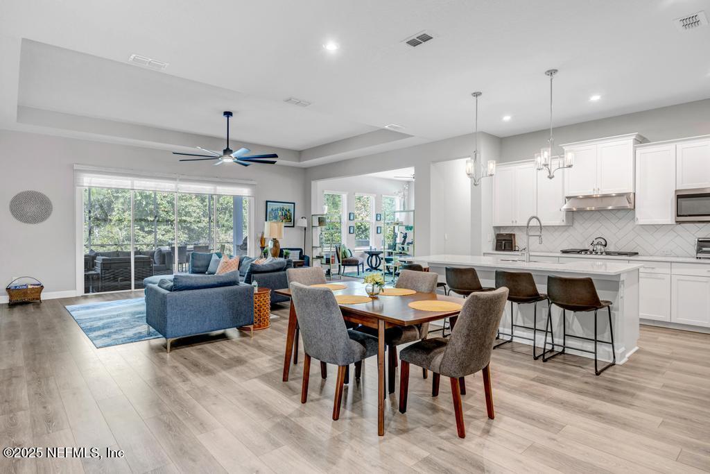 323 Glenneyre Circle St. Augustine, FL 32092 - Photo 8 of 53 a view of a dining room with furniture window and wooden floor