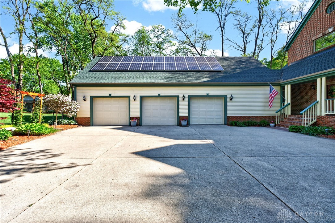 330 South Alpha Bellbrook Road Bellbrook, OH 45305 - Photo 82 of 87 This residence features solar panels and a multi-car garage, enhancing both efficiency and convenience.
