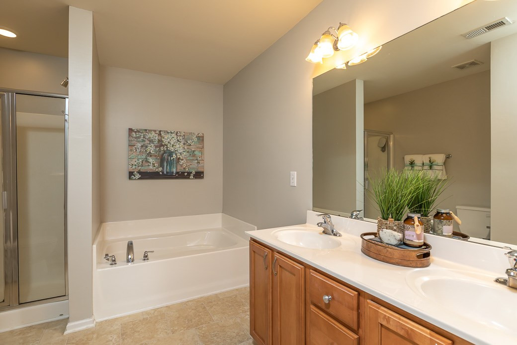 8212 Belneath Court Raleigh, NC 27613 - Photo 6 of 9 Large spa like bathroom with separate Shower and Garden Tub and Dual Vanities Master Bath/Spa