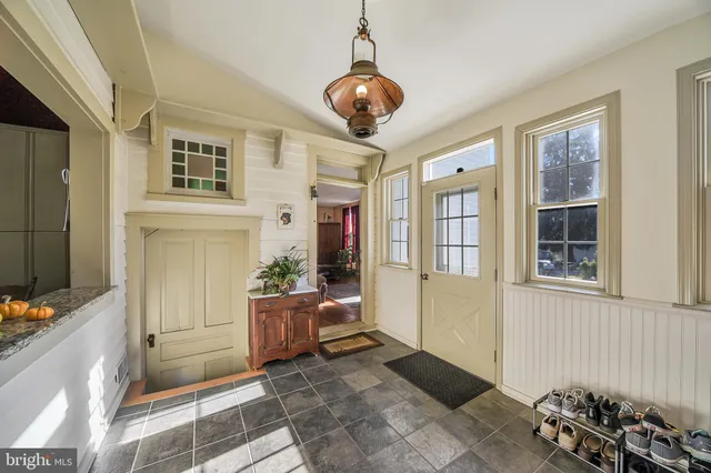 a living room with furniture and windows