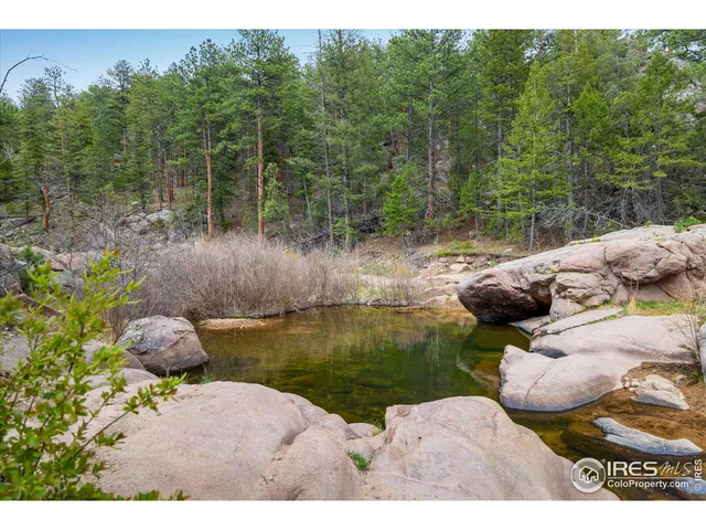 a view of a house with a backyard space