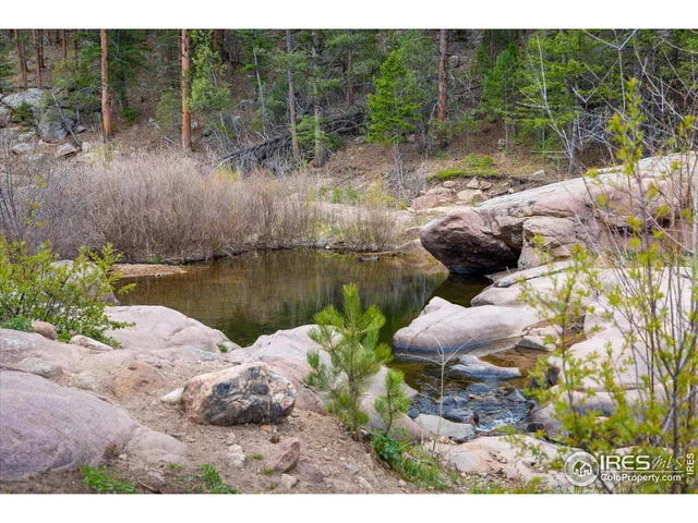 a view of a park with swings and slides