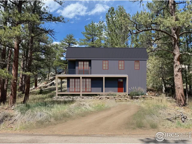 a view of a yard with plants and trees