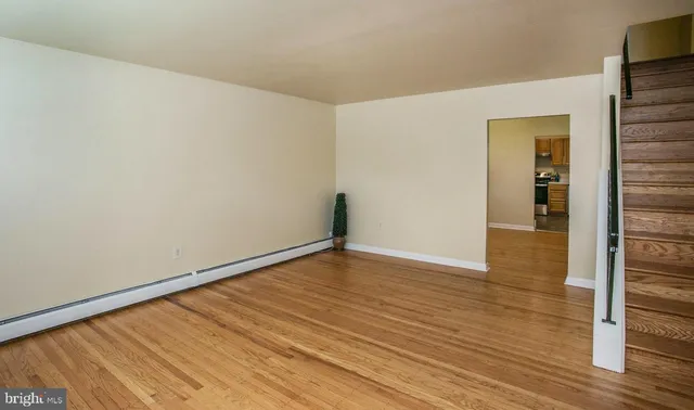 a view of an entryway with wooden floor