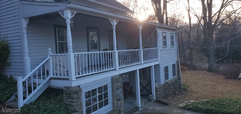 148 Mt Grove Road Califon, NJ 07830 - Photo 12 of 14 a view of a house with brick walls and wooden deck