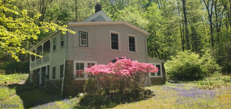 148 Mt Grove Road Califon, NJ 07830 - Photo 2 of 14 a front view of a house with garden