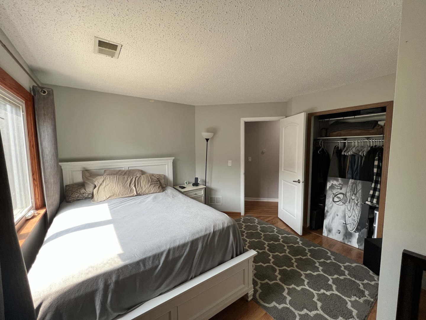 1230 Chalet Road, Unit 204 Naperville, IL 60563 - Photo 13 of 17 a bedroom with a bed and a mirror