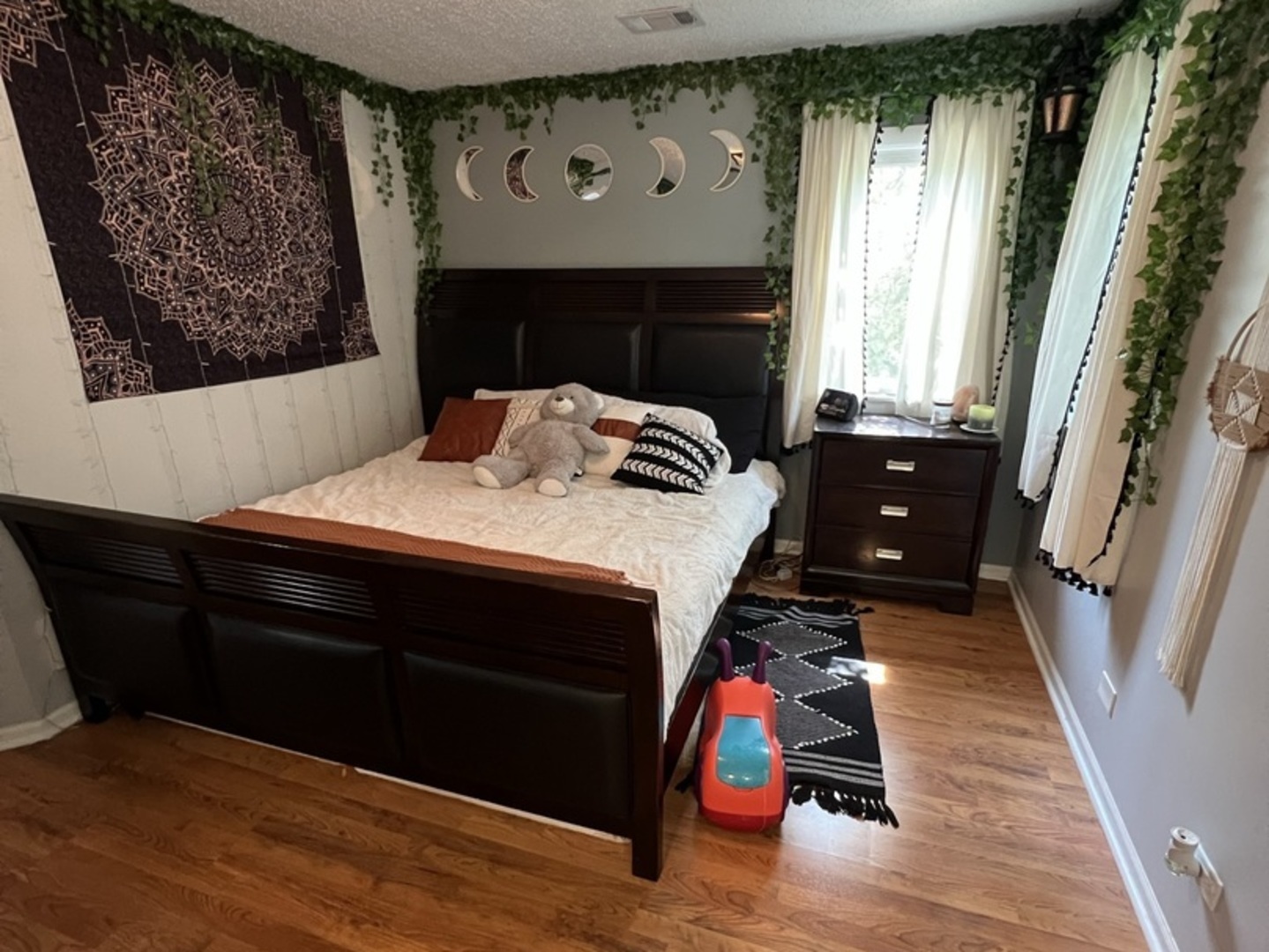 1230 Chalet Road, Unit 204 Naperville, IL 60563 - Photo 15 of 17 a bedroom with a bed and wooden floor