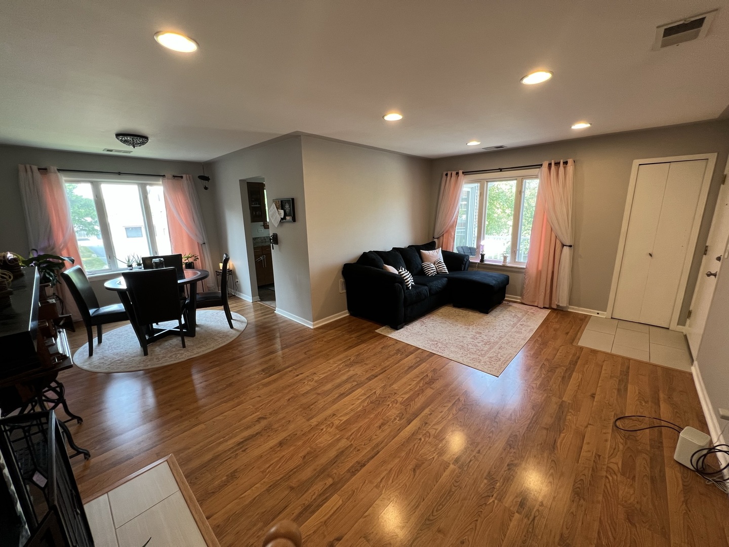 1230 Chalet Road, Unit 204 Naperville, IL 60563 - Photo 2 of 17 a living room with furniture and wooden floor