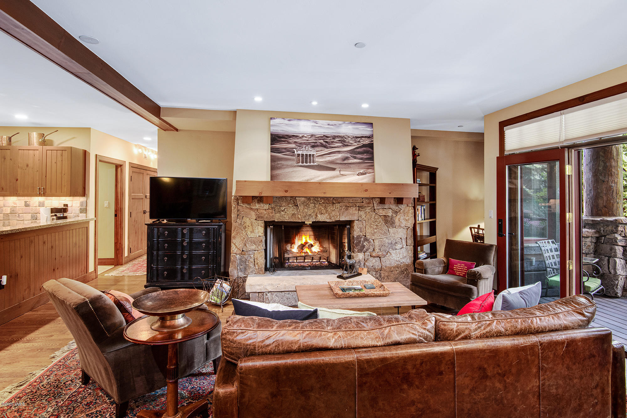 180 Daybreak Ridge Road, Unit 409 Avon, CO 81620 - Photo 11 of 47 a living room with furniture fireplace and flat screen tv
