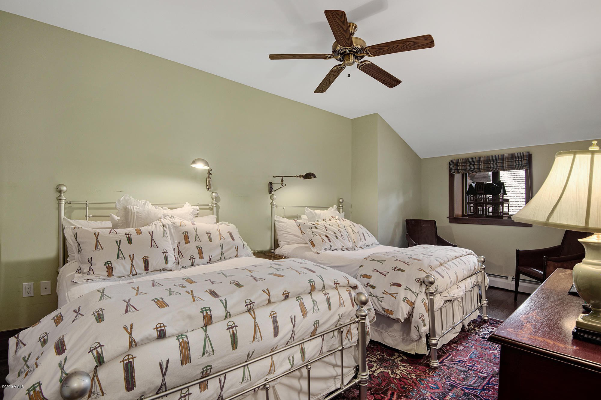 180 Daybreak Ridge Road, Unit 409 Avon, CO 81620 - Photo 22 of 47 a bedroom with two beds and painting on the wall