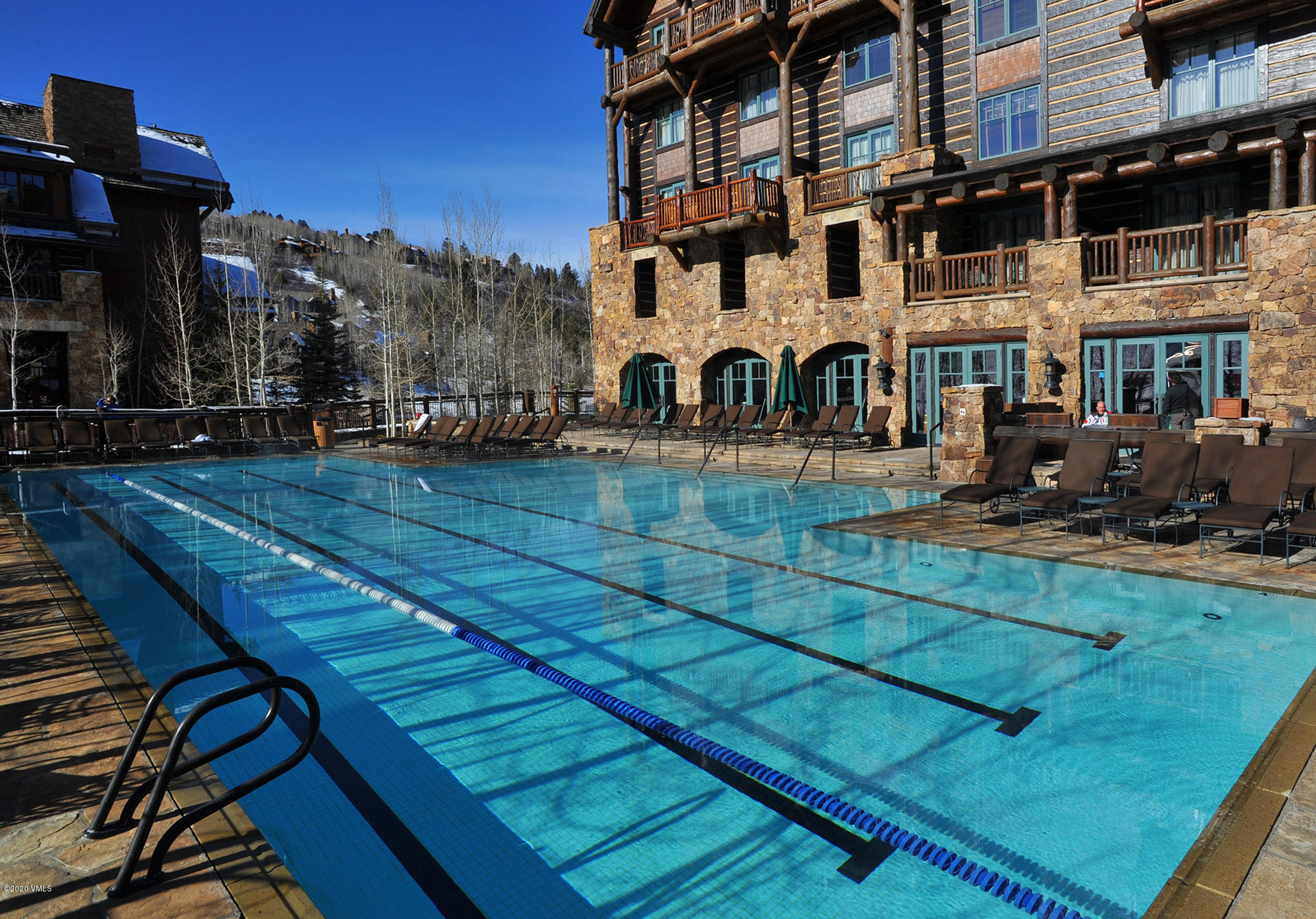 180 Daybreak Ridge Road, Unit 409 Avon, CO 81620 - Photo 33 of 47 a front view of a building with a garden