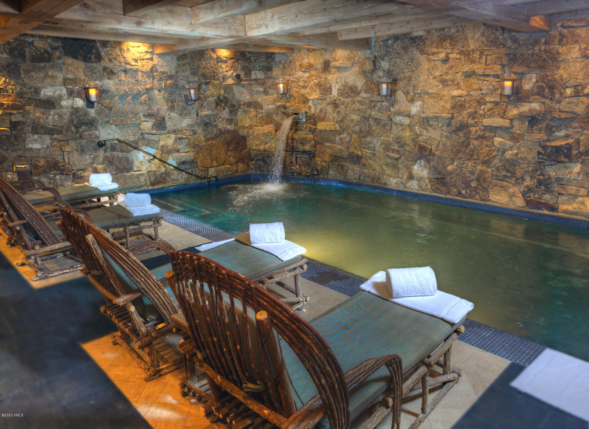 180 Daybreak Ridge Road, Unit 409 Avon, CO 81620 - Photo 37 of 47 a view of a balcony with chairs