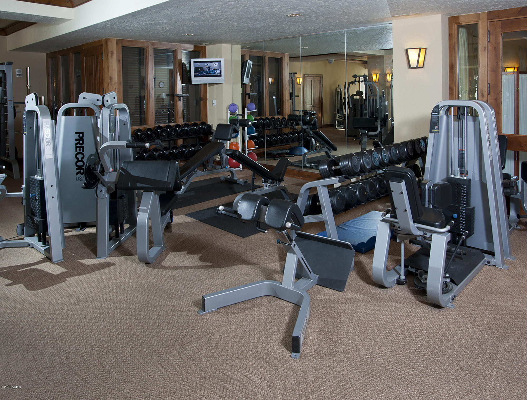 180 Daybreak Ridge Road, Unit 409 Avon, CO 81620 - Photo 39 of 47 a view of a room with gym equipment