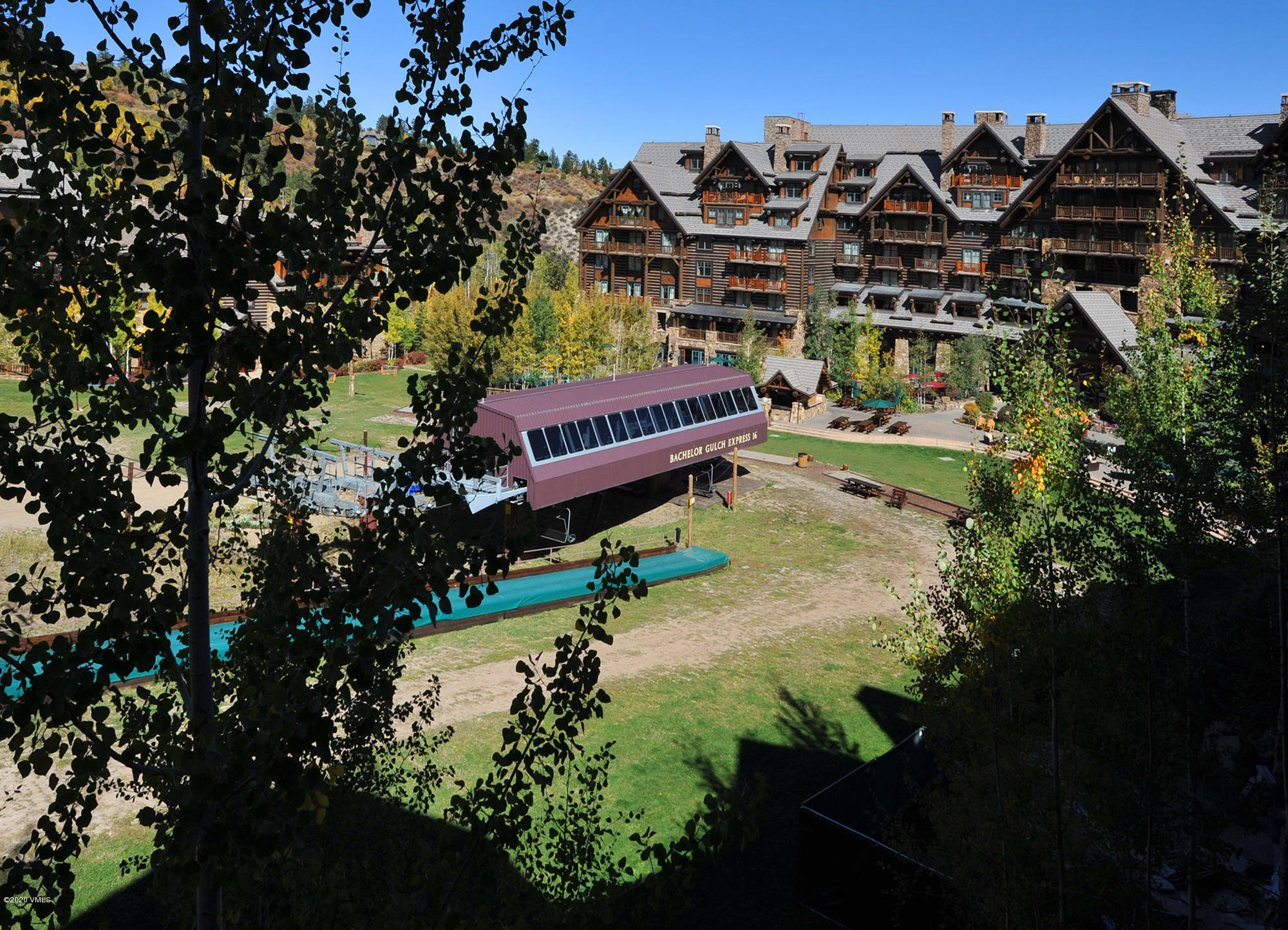 180 Daybreak Ridge Road, Unit 409 Avon, CO 81620 - Photo 42 of 47 a view of a large building with a tree in the background