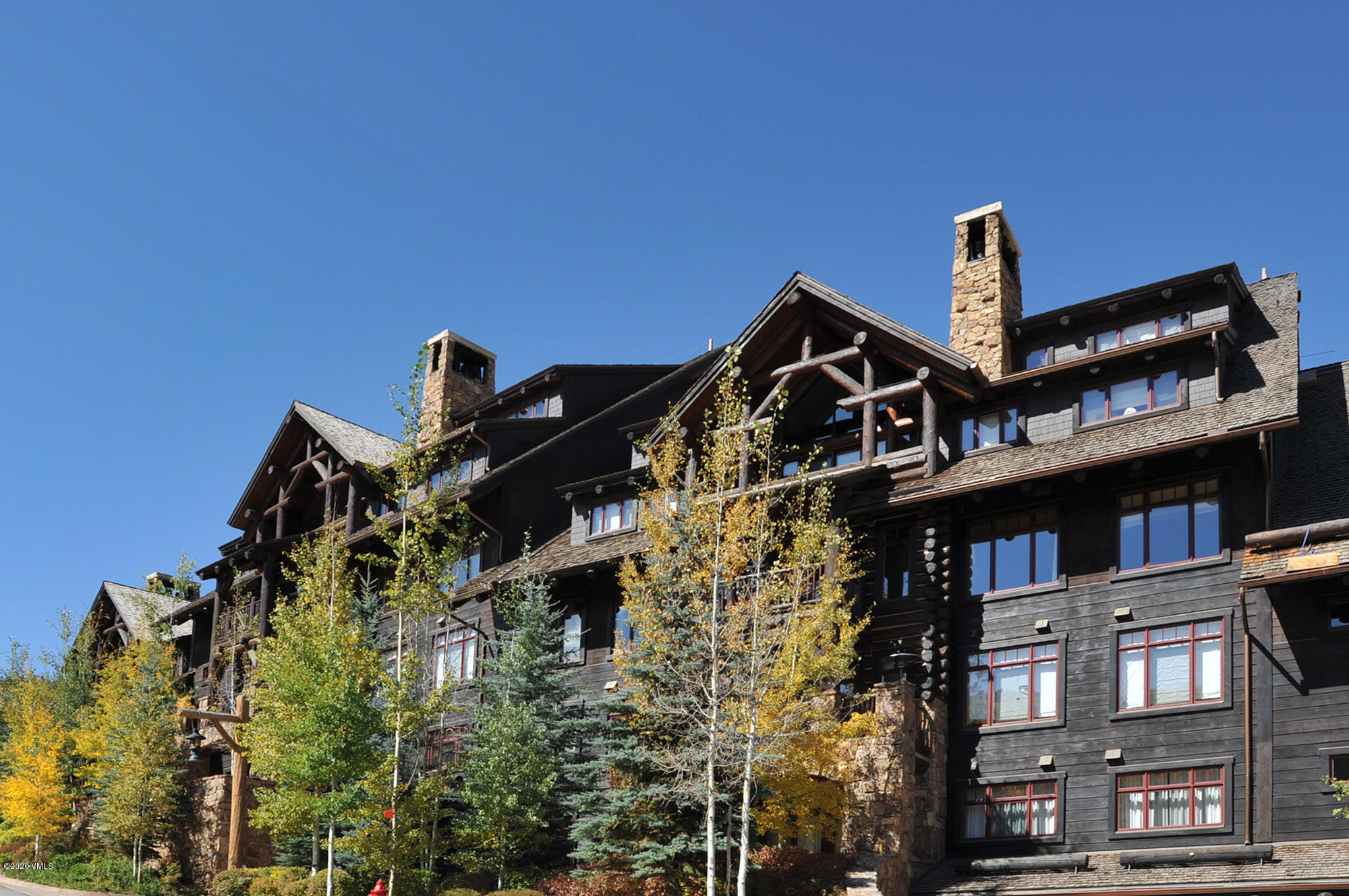 180 Daybreak Ridge Road, Unit 409 Avon, CO 81620 - Photo 47 of 47 a front view of a house with a yard