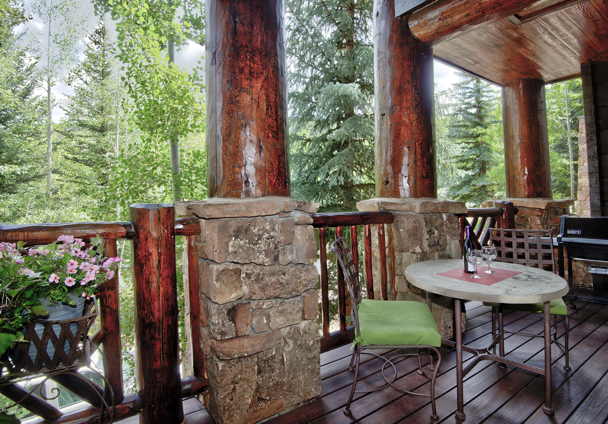 180 Daybreak Ridge Road, Unit 409 Avon, CO 81620 - Photo 5 of 47 a view of a chairs and table in the patio