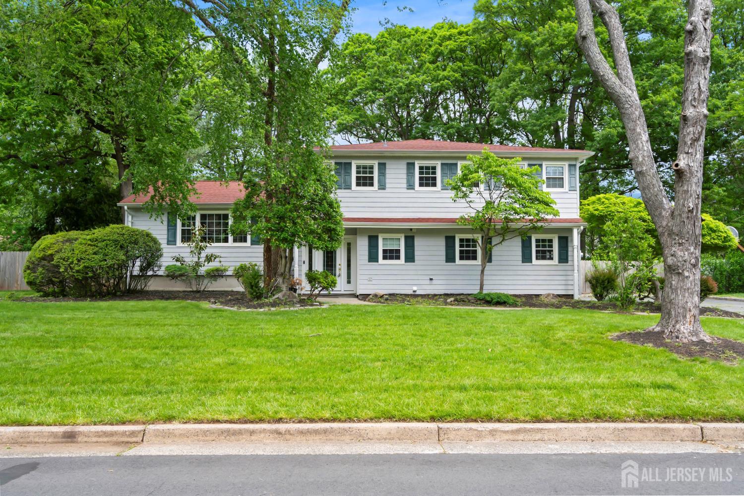 10 Woodruff Road Edison, NJ 08820 - Photo 1 of 18 a front view of a house with a yard