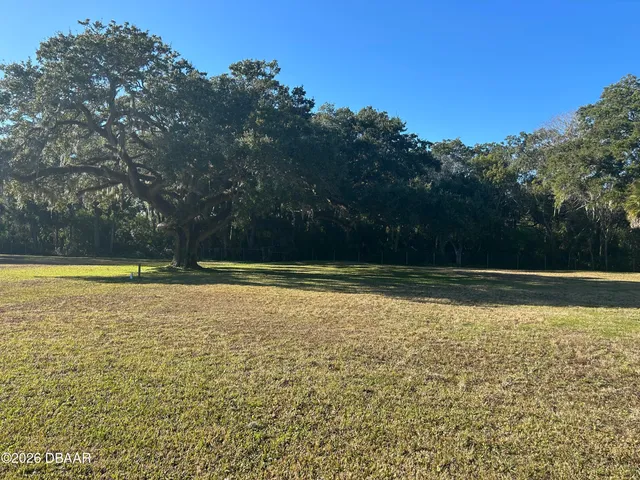 a view of a swimming pool and a yard