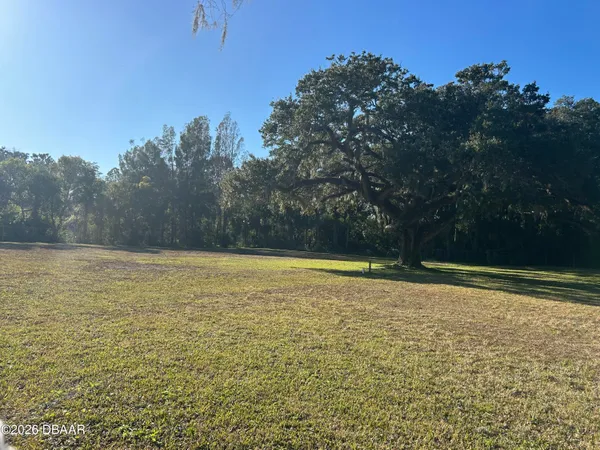 a view of a swimming pool with an outdoor space and seating area