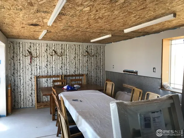 a view of kitchen and dining room with furniture